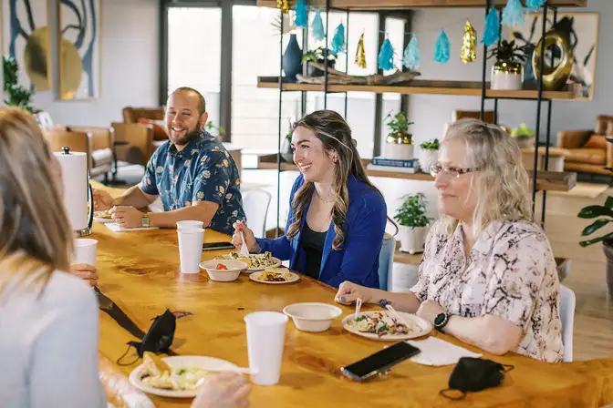 A group talking while eating lunch